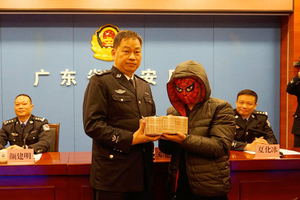 Whistleblower wears Spiderman mask to receive $68,000 award