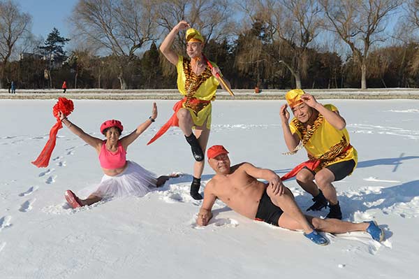 Winter swim enthusiasts celebrate the Year of the Monkey