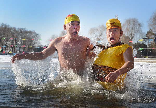 Winter swim enthusiasts celebrate the Year of the Monkey