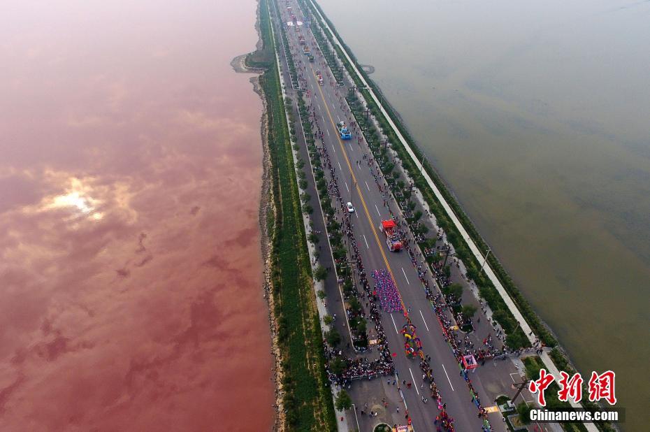 Ancient salt lake turns pink due to algae