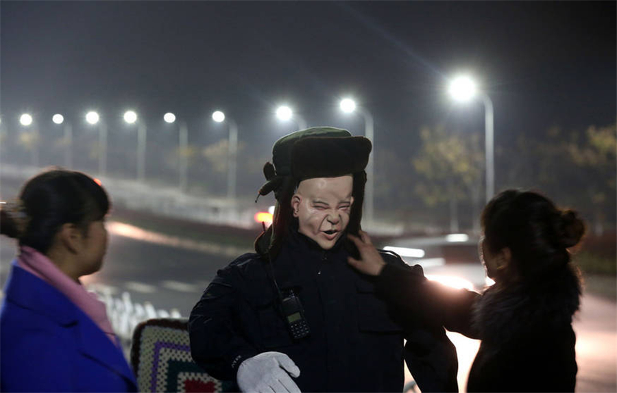 Cemetery in central China deploys creepy robot guard to escort female patrol guards at night