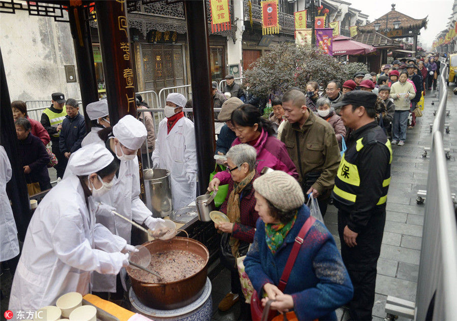 Chinese mark festival with 'eight treasure porridge'