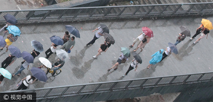 Heavy rains bring respite to scorching Beijing