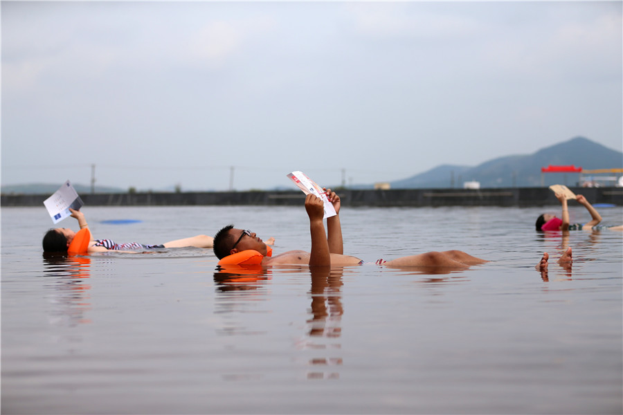 Swimmers float in 'Dead Sea' in Dalian