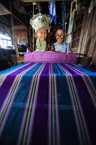 Girls learn traditional weaving in Rongshui, China's Guangxi