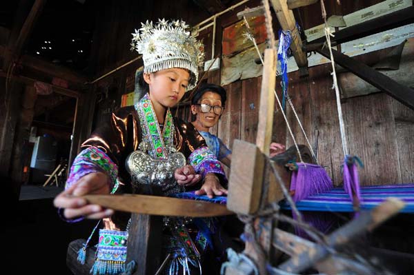 Girls learn traditional weaving in Rongshui, China's Guangxi