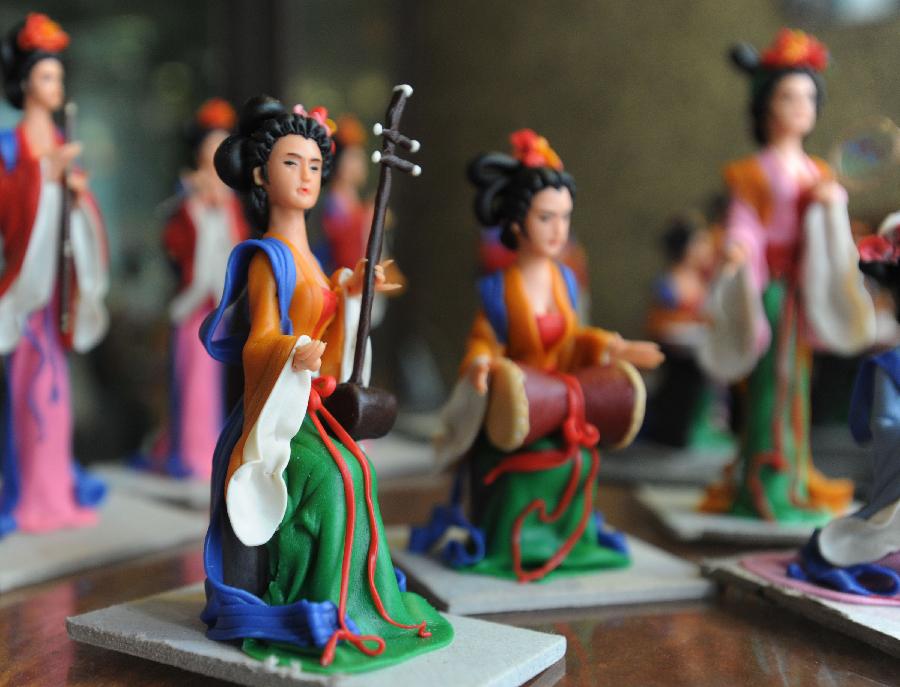 Folk artist makes pretty dough figurines