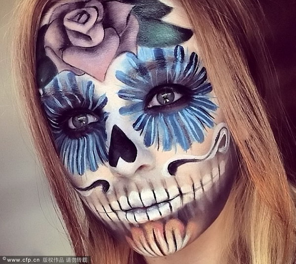 Make-up artist creates special-effects on her face