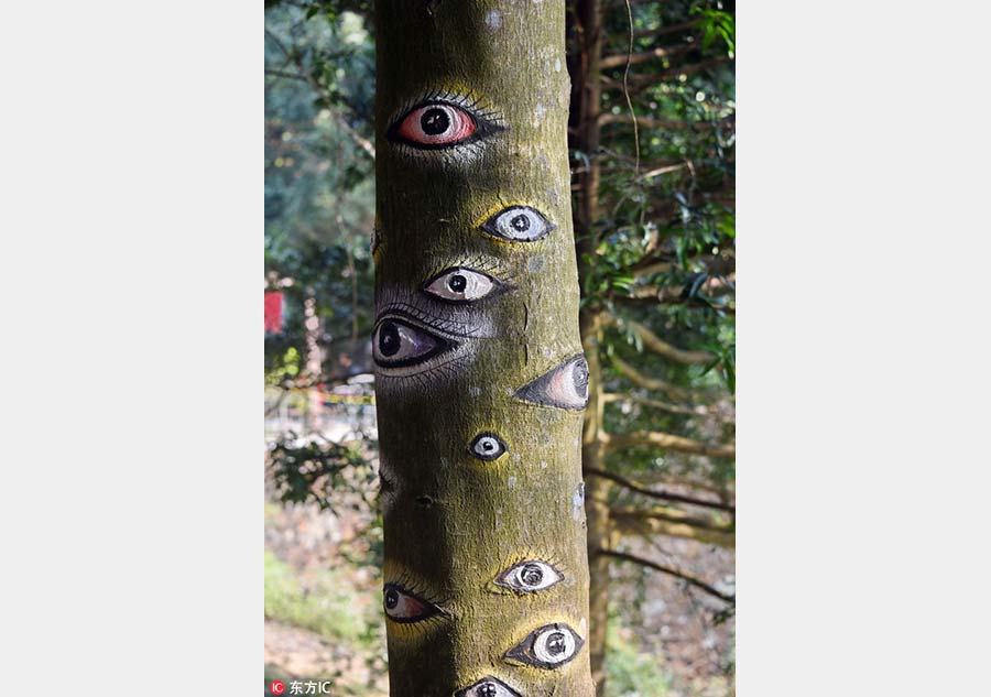 Paintings bring tree trunks to life