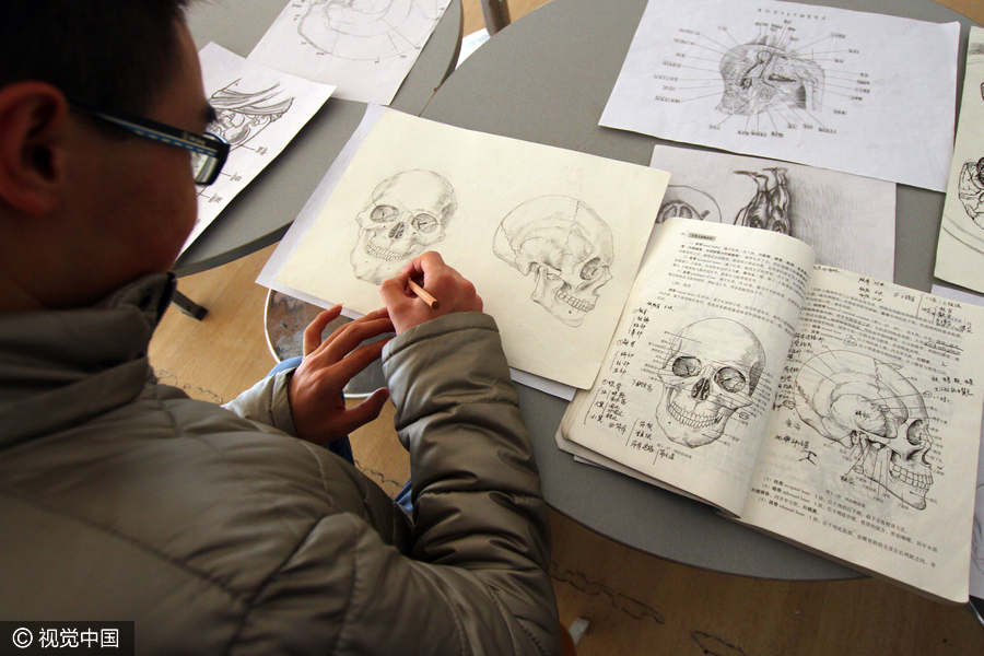 University students create skeleton paintings