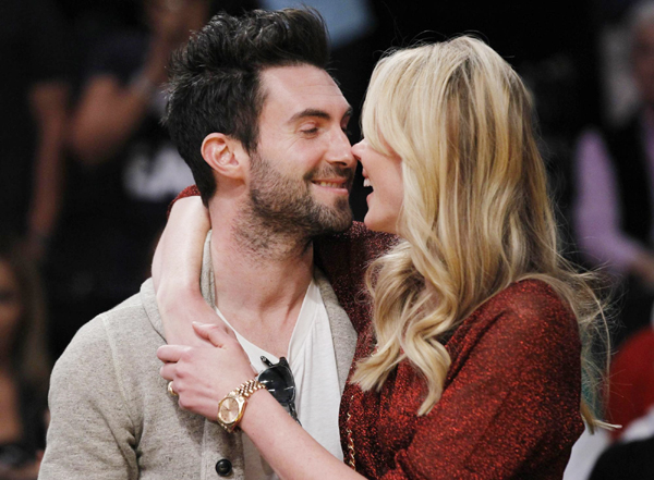 Levine nuzzles with Russian model