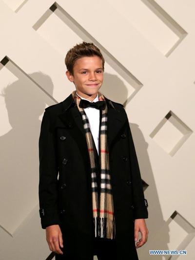 Like father like son: Romeo Beckham attends Burberry campaign