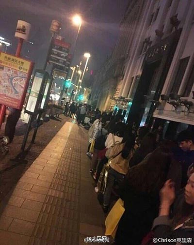 Fans line up in Shanghai to pose with postbox touched by pop star