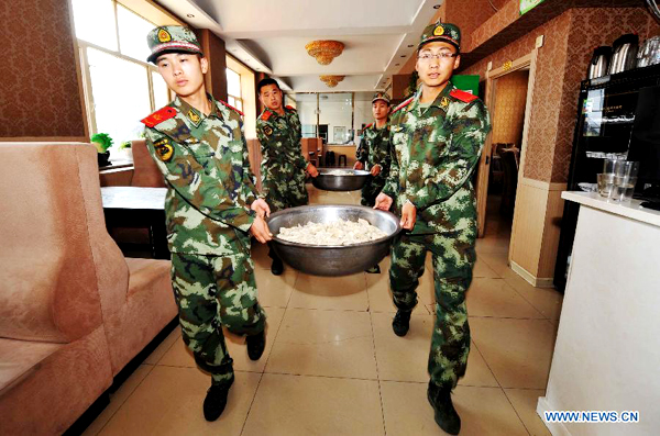 Residents cook dumplings for flood relief workers in Heilongjiang