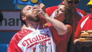 Hot dog-eating champ devours 70 in 10 minutes