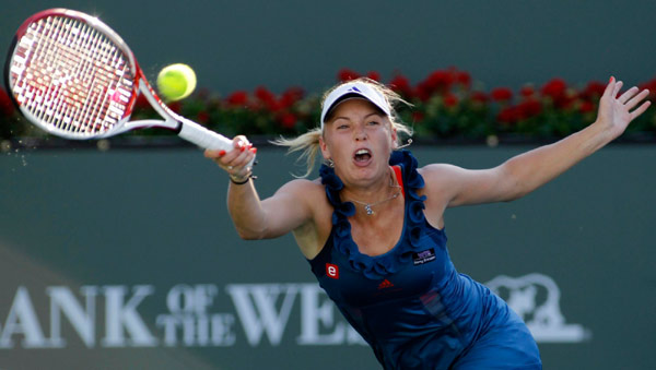 Wozniacki through, Clijsters out injured at Indian Wells