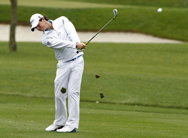 McIlroy holds off Woods to take top spot