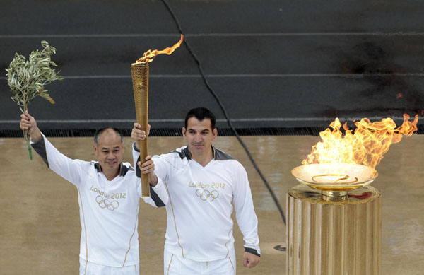 London receives flame in rainy Athens