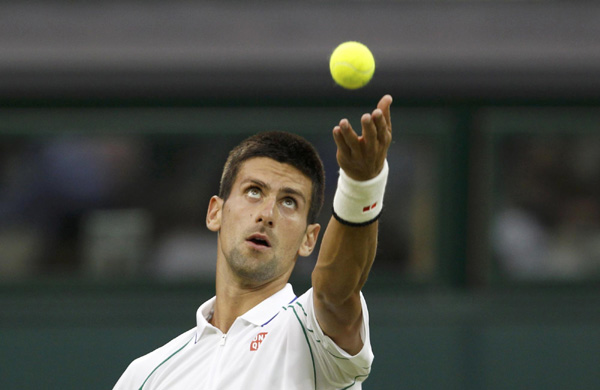 Djokovic shuts out Harrison under closed roof