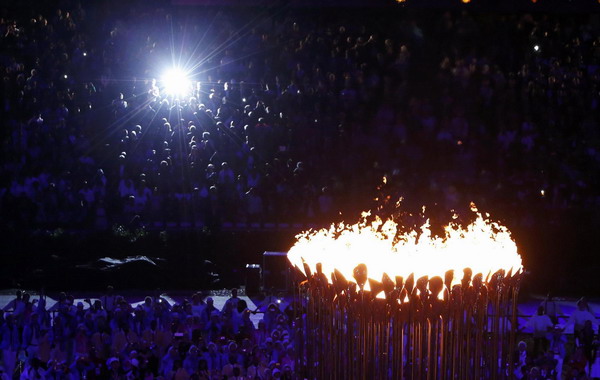 Seven teenagers light Olympic cauldron
