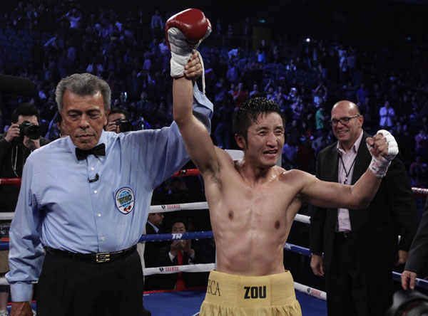 China's Olympic champion Zou wins professional debut