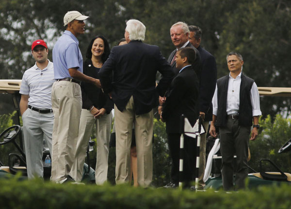 Obama plays golf with NBA player