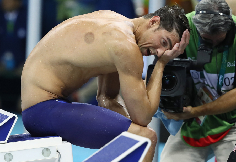 Phelps adds Olympic gold medal haul to historic 21