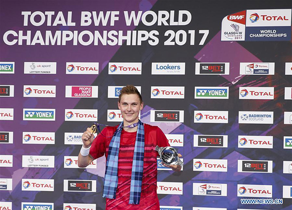 China's Super Dan beaten by Denmark's Axelsen in badminton worlds final