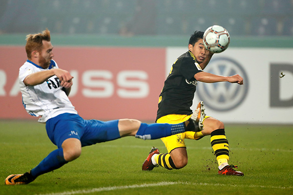 Dortmund shrugs off mini-slump to win 5-0 in German Cup