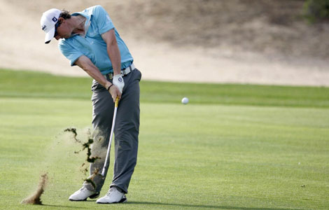 McIlroy keeps Dubai lead as Woods hits form