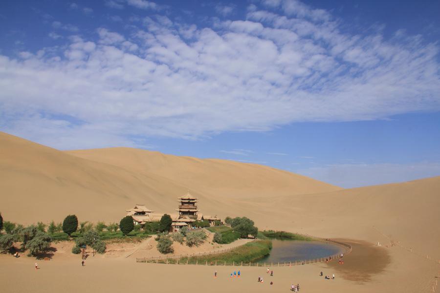 Tourists visit Mingsha Mountain in Dunhuang, NW China