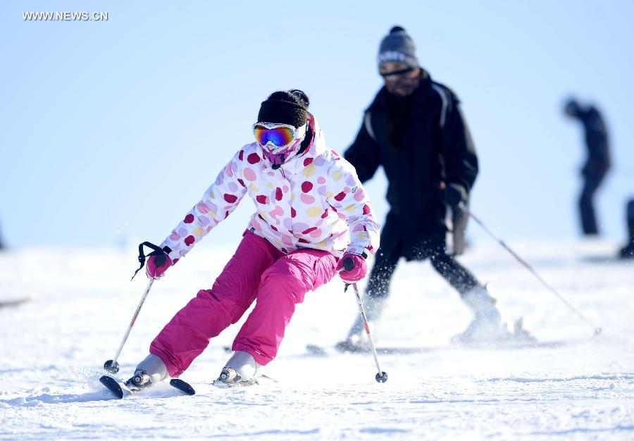 Tourists ski in China's Shenyang