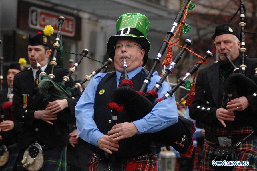 People take part in St. Patrick's Day Parade in Vancouver