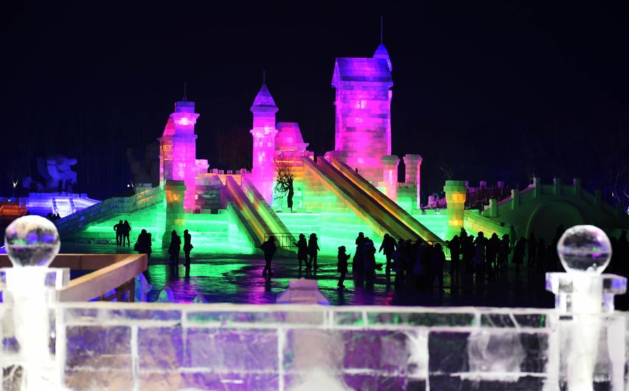 Night view of sculptures at snow expo in NE China