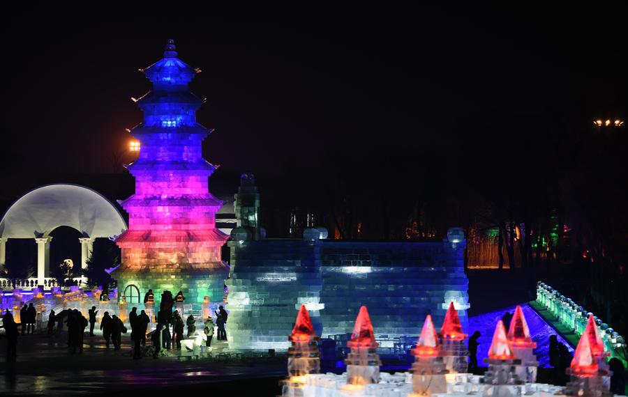 Night view of sculptures at snow expo in NE China
