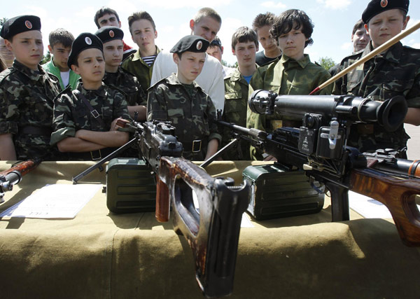 Ukrainian teenagers armed at military base