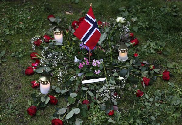 Sea of flowers marks vigil for twin attack victims