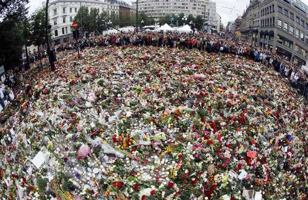 Sea of flowers marks vigil for twin attack victims