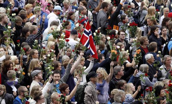 Sea of flowers marks vigil for twin attack victims