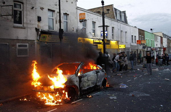 Riots continue in London, Cameron cuts short holiday