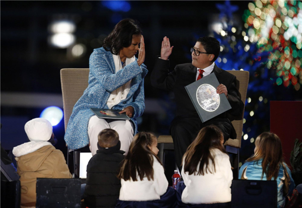 Obama lights up National Christmas tree