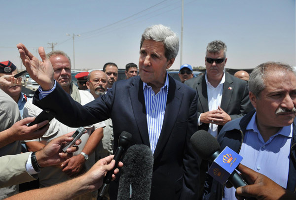 Syrian refugees demand help from Kerry at camp