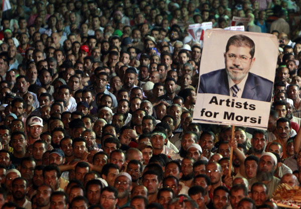 Egyptian forces kill dozens of supporters of Morsi