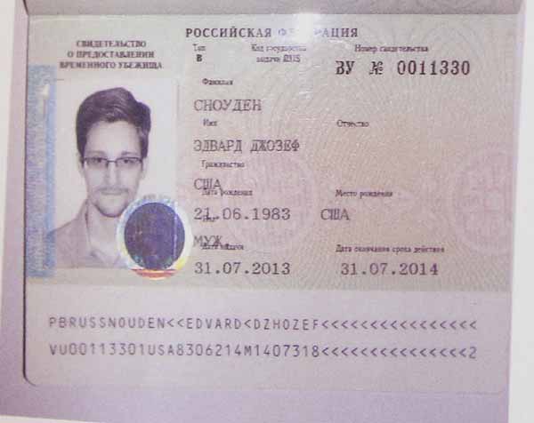 Snowden 'safe and fine' after getting permit to enter Russia