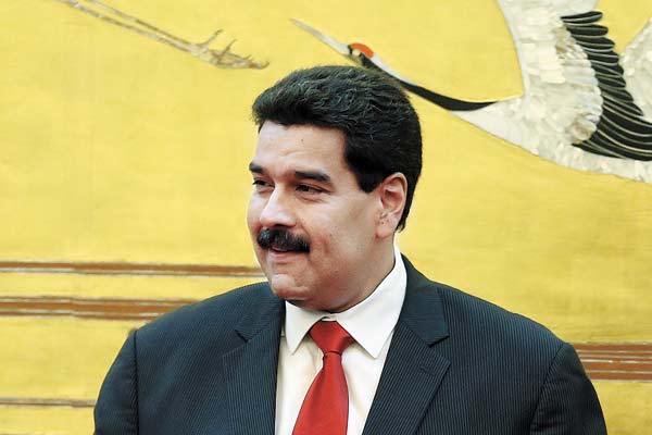China signs 12 deals with Venezuela