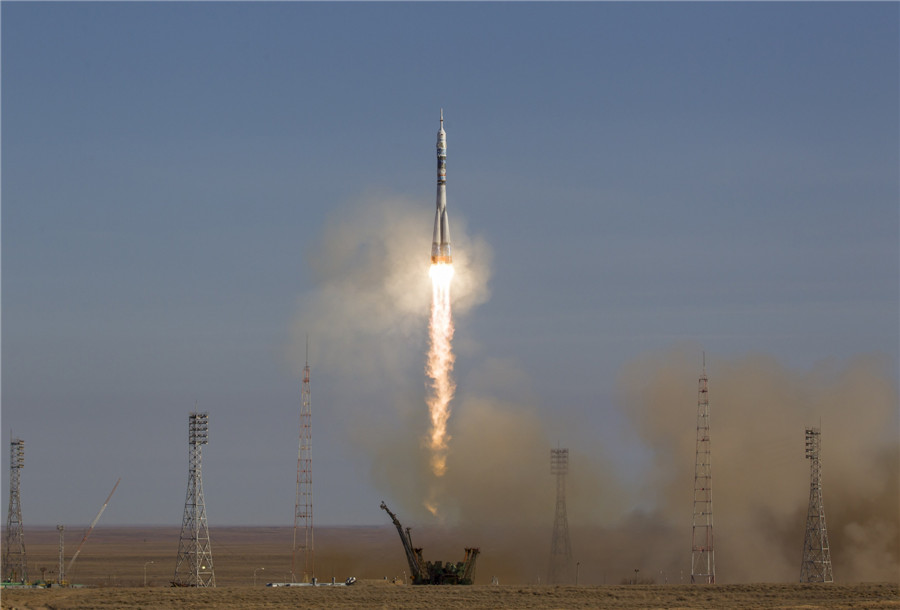 Soyuz rocket flies Olympic torch to space station