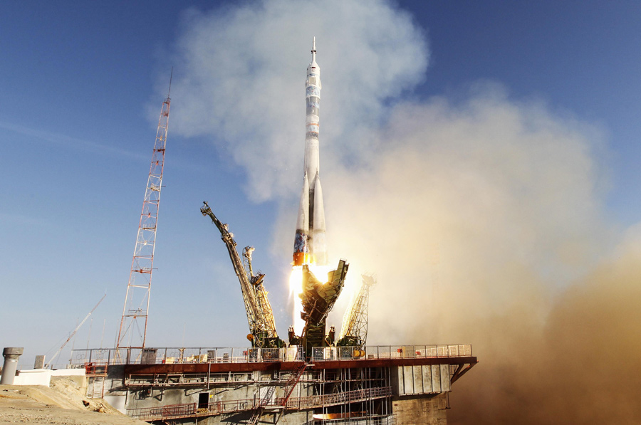 Soyuz rocket flies Olympic torch to space station