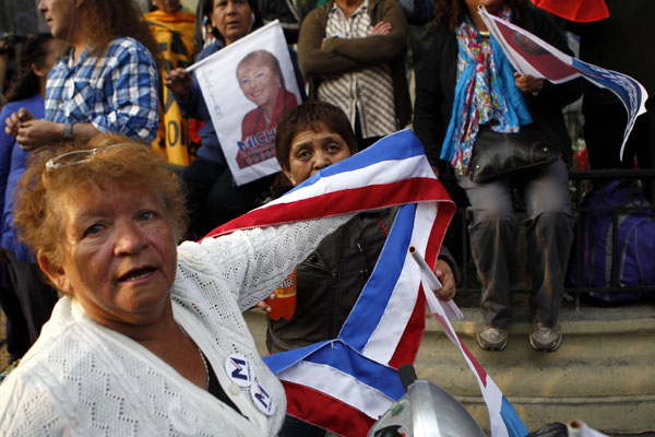 Bachelet triumphs in Chile election but faces runoff