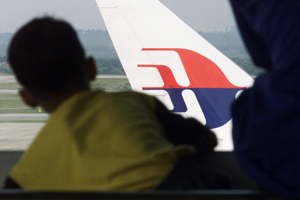 Malaysia Airlines holds press conference in Beijing on missing flight