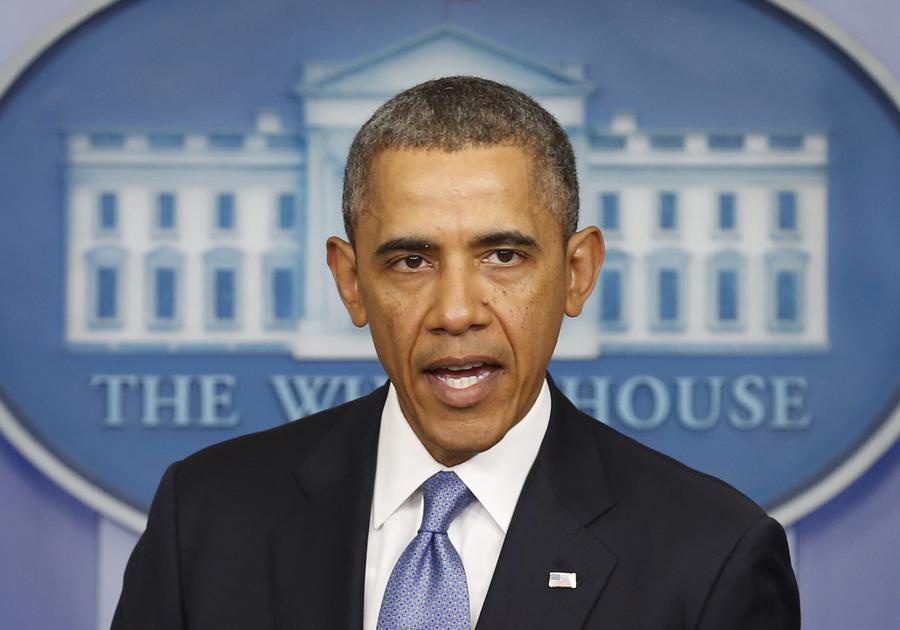 Obama imposes sanctions on Russians over Crimea